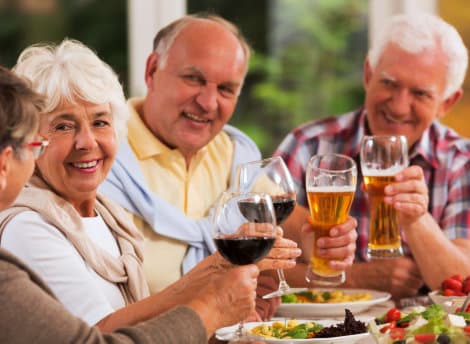 group of senior people drinking a beer