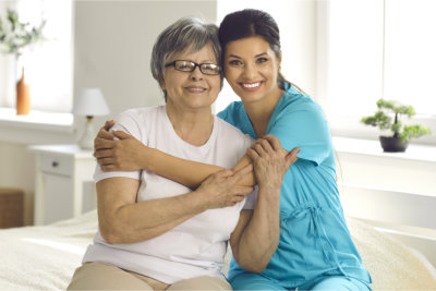 nurse visits senior woman at home