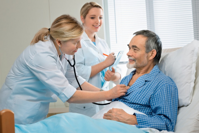 physician checking senior man's condition