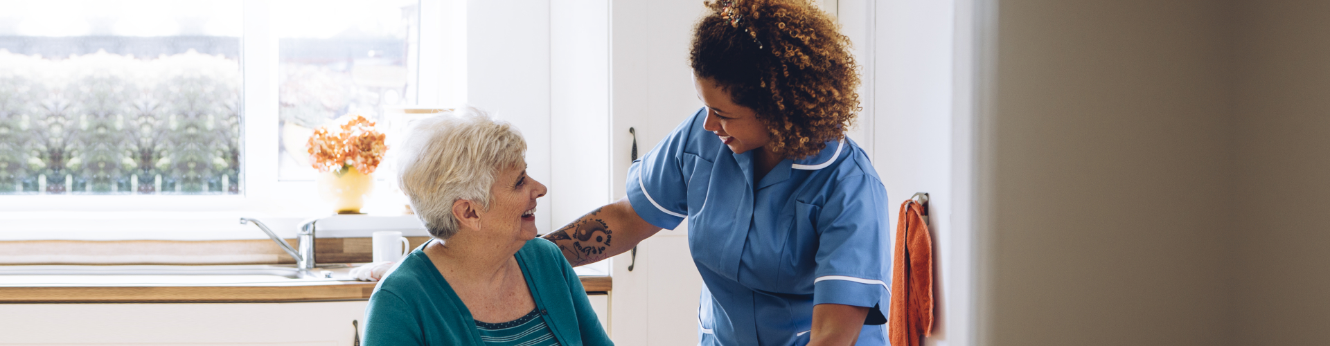 caregiver serving senior woman