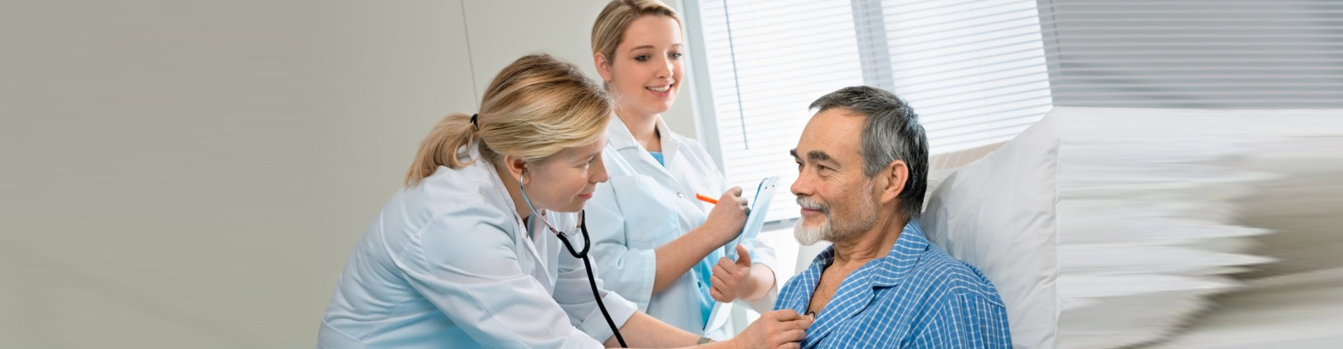 physician checking senior man's condition