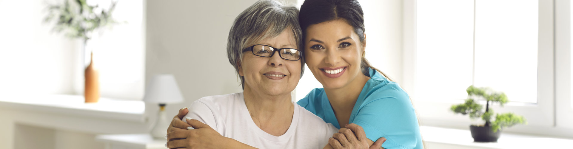 nurse visits senior woman at home